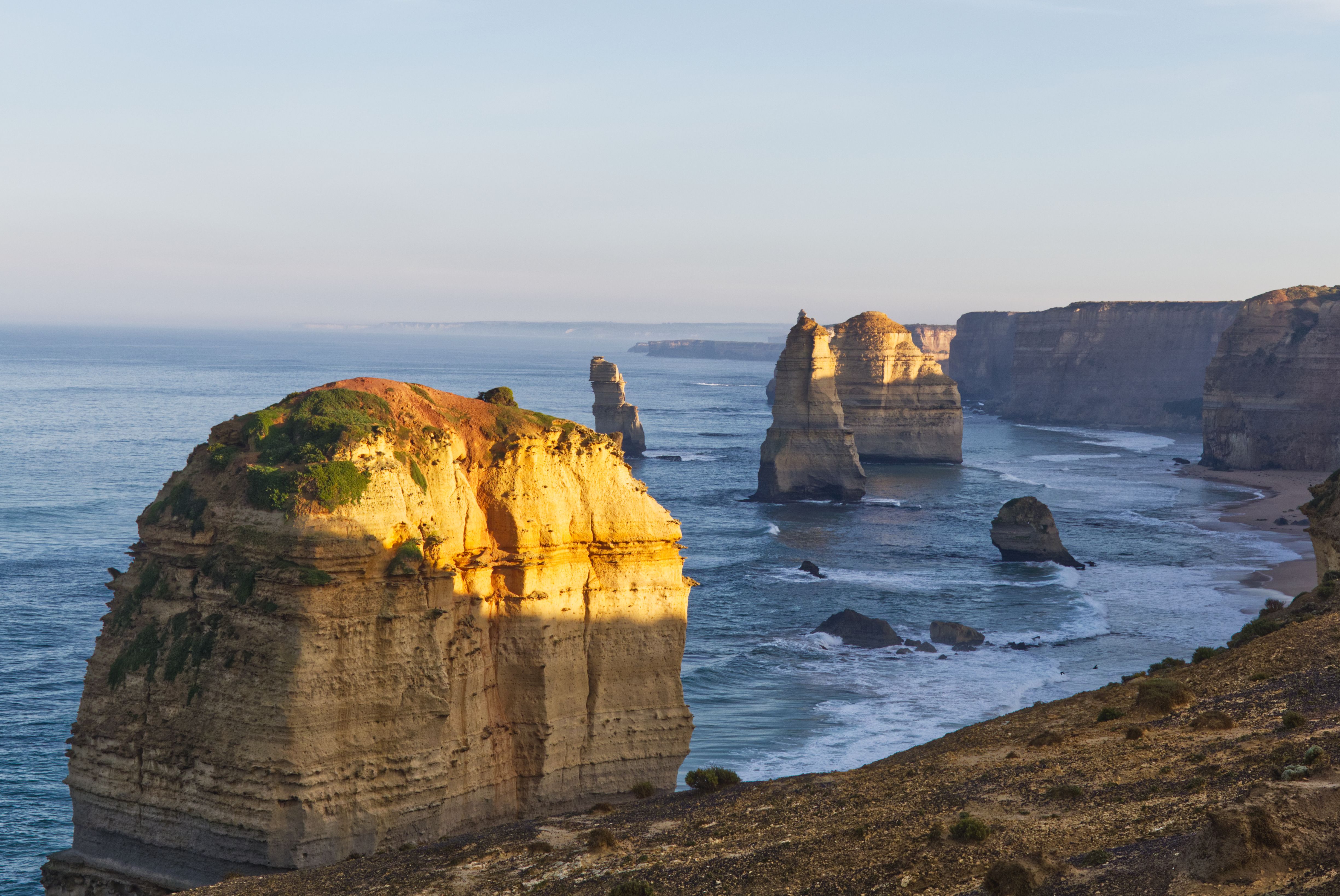 Breathtaking shot of the iconic Twelve Apostles rock formation along the Great Ocean Road in Victoria, Australia at sunrise.