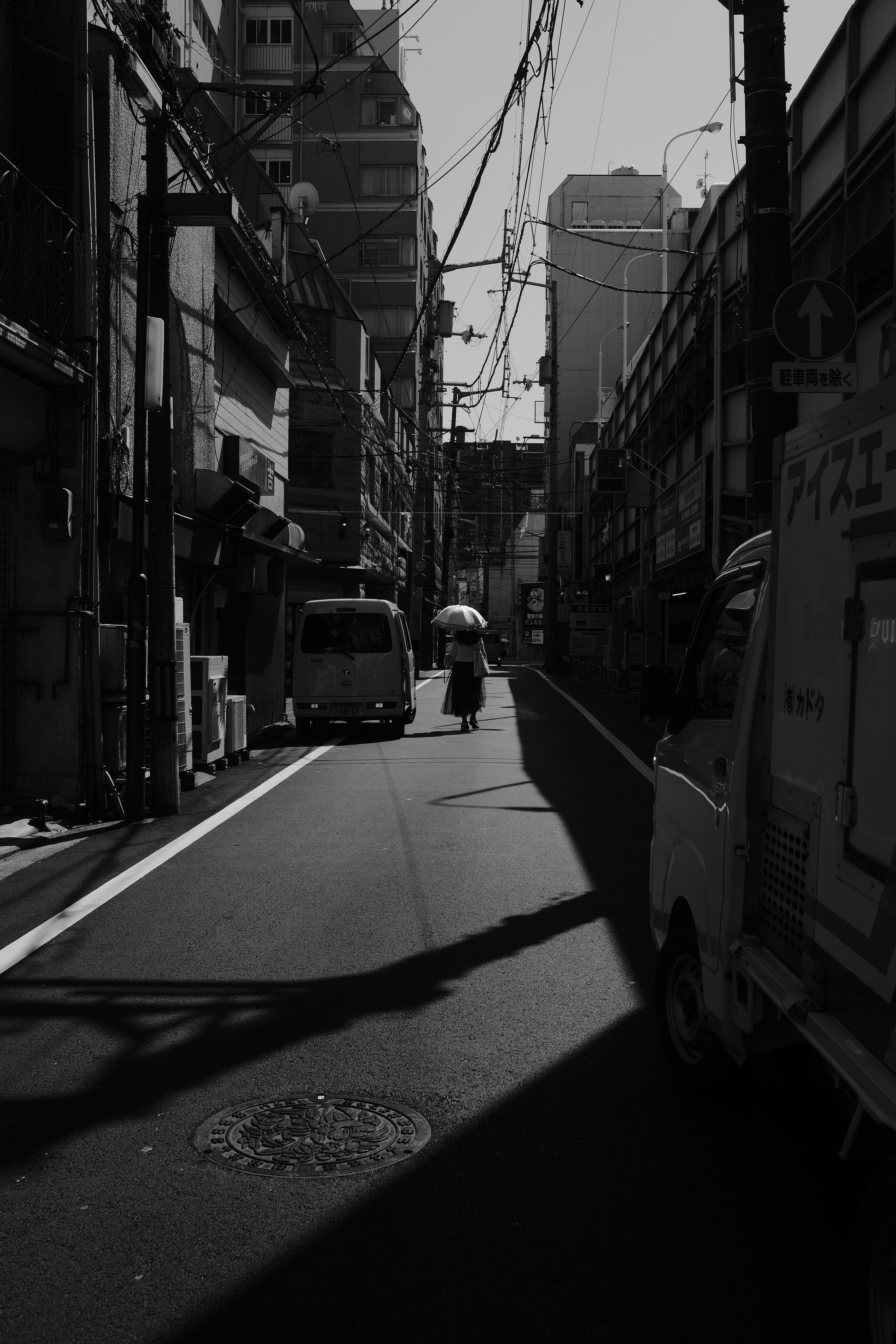 Black and White Urban Street Scene with Silhouettes · Free Stock Photo