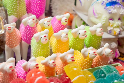 Vibrant sugar figures on display, celebrating Mexican Day of the Dead customs.