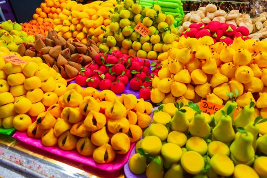 Brightly colored traditional Mexican candies in fruit shapes on display in Toluca de Lerdo market.