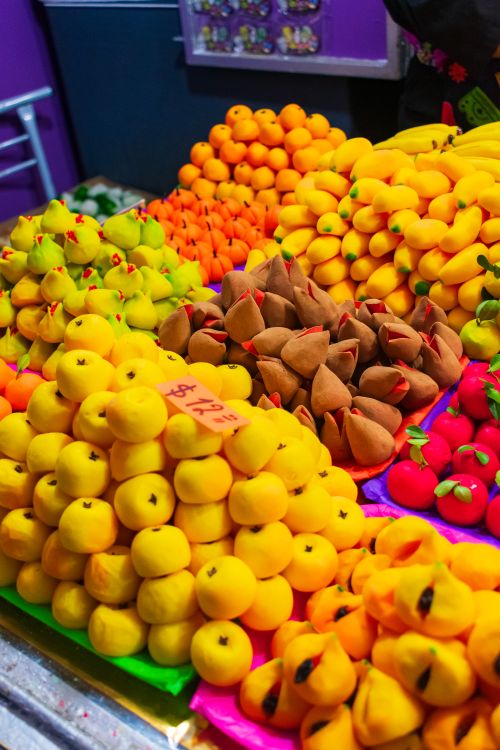 Free Colorful traditional Mexican sweets on display in Toluca market, showcasing vibrant marzipan treats. Stock Photo
