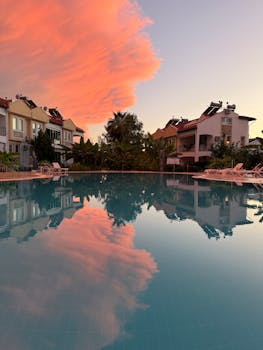 Breathtaking view of a colorful sunset reflecting over a tranquil pool in Turkey.