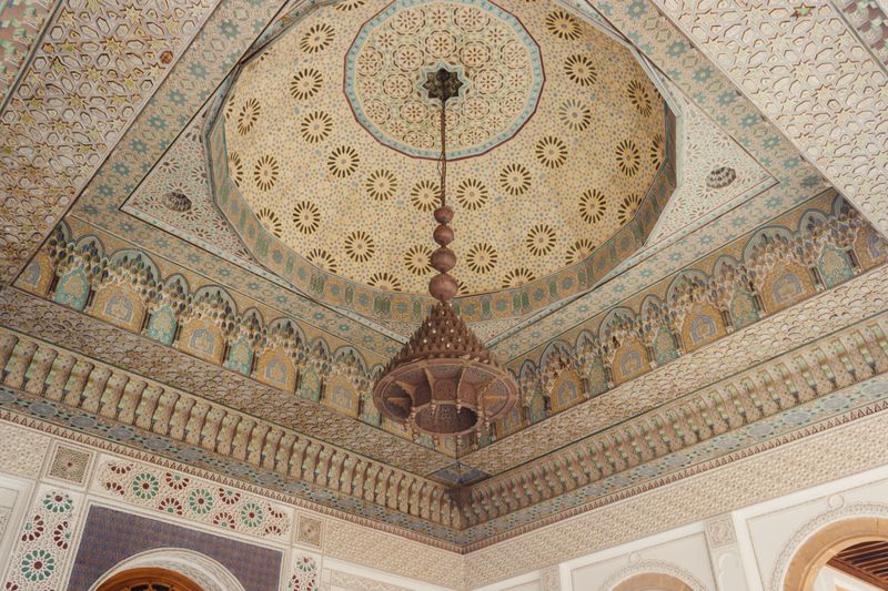 Intricate Moroccan ceiling with chandelier