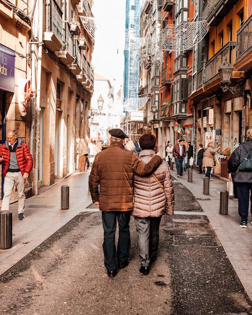 Free Couple Walking on Street Stock Photo