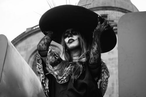 Free A person dressed as a Catrina with traditional makeup and attire in Toluca de Lerdo, Mexico. Stock Photo
