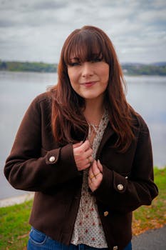 Young woman posing by a river in Harrisburg, Pennsylvania during fall.