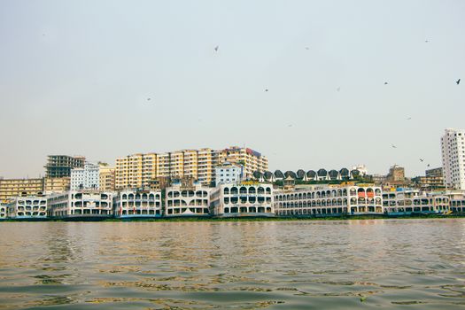 Explore vibrant Dhaka's riverfront with stunning architectural views.