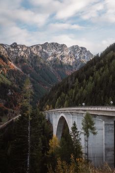 Discover the breathtaking viaduct set against the majestic autumn Alps in Eisenerz, Austria.