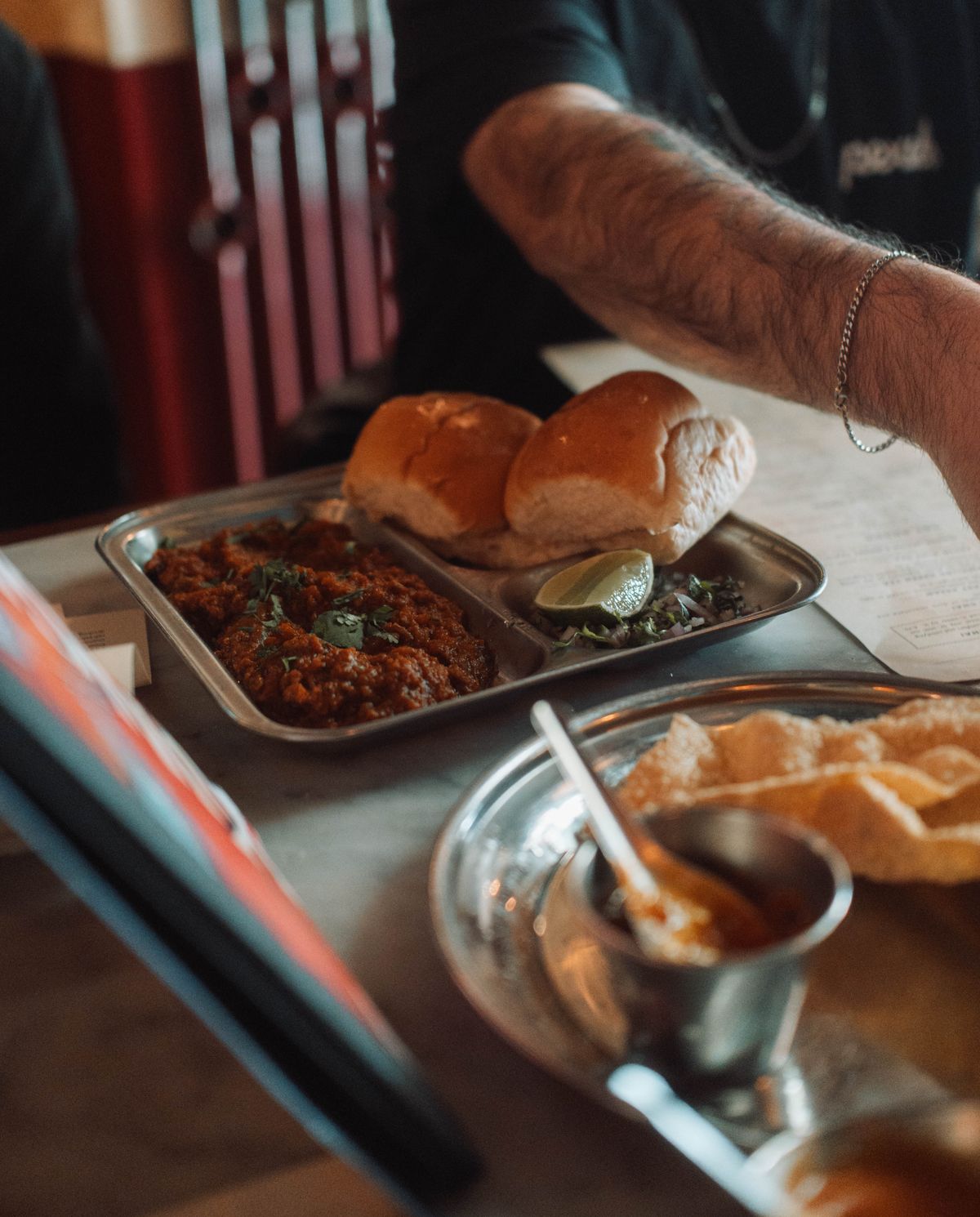 Pav bhaji served in an Indian restaurant setting