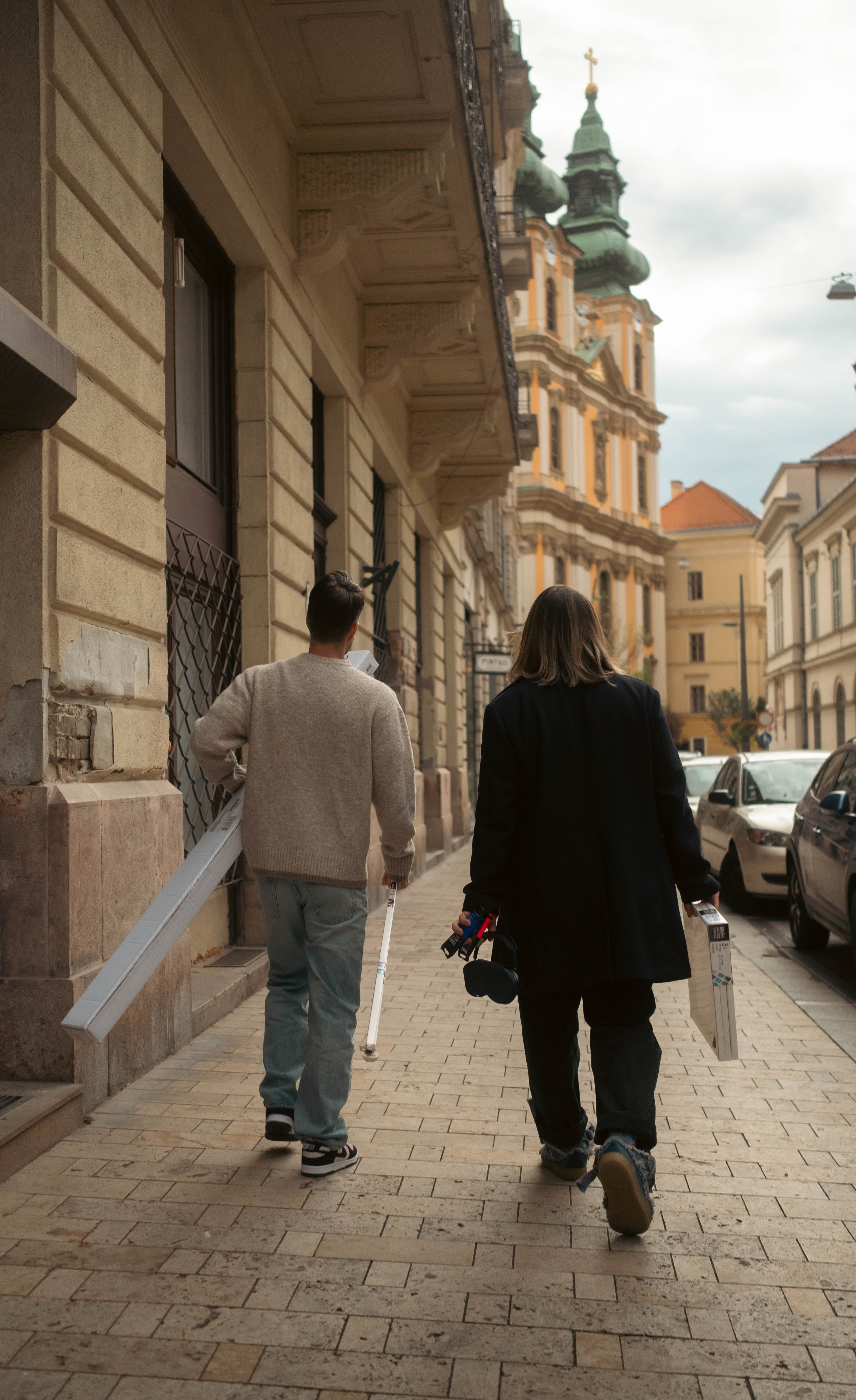People Walking in Historic European City Street · Free Stock Photo