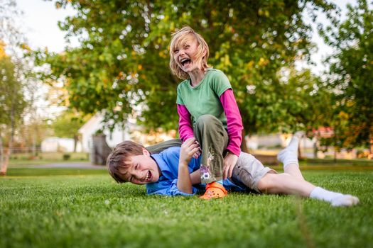 Laughter fills the air as two kids enjoy a playful summer day outdoors in Ontario.
