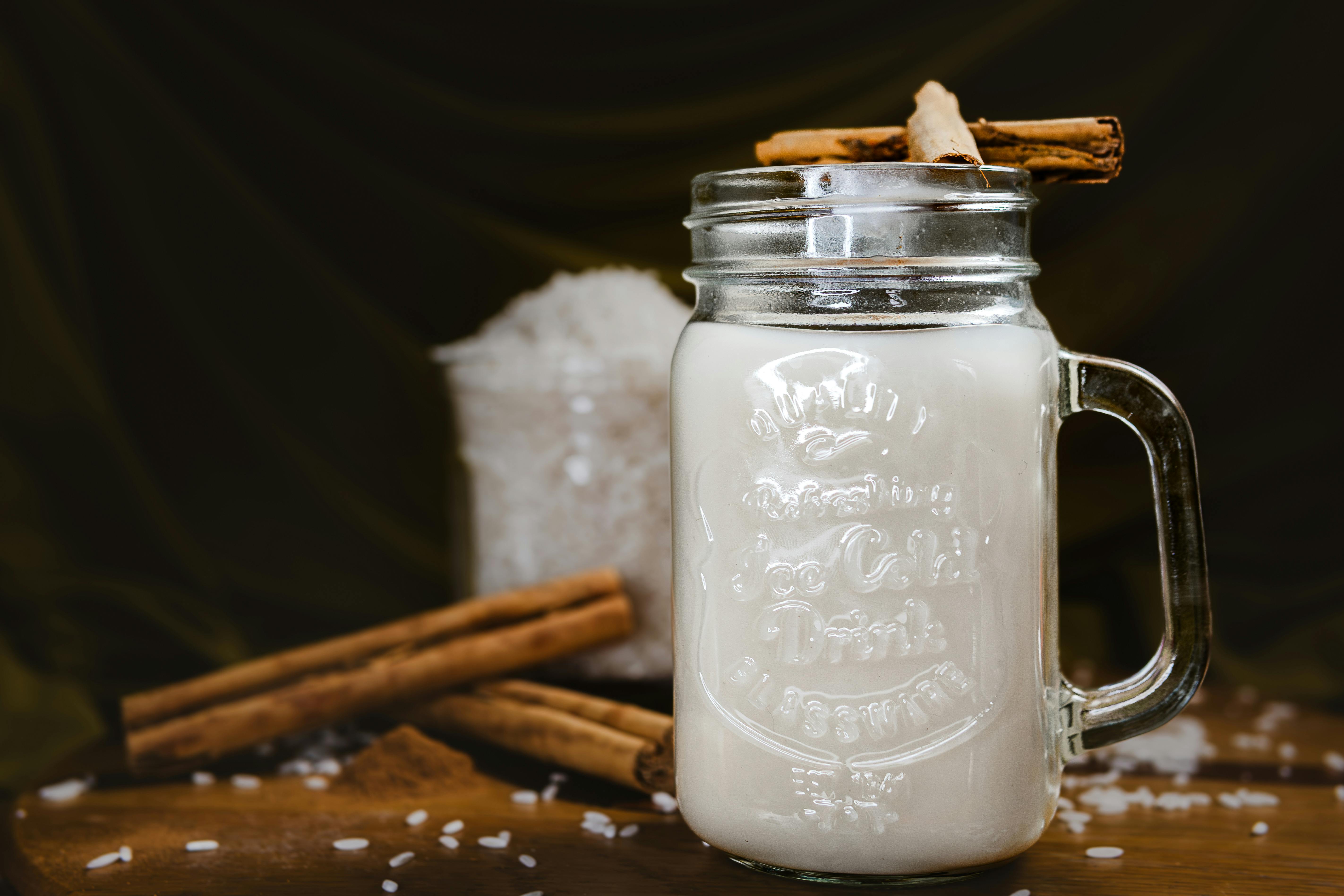 Refreshing traditional Mexican horchata served in a mason jar with cinnamon sticks.