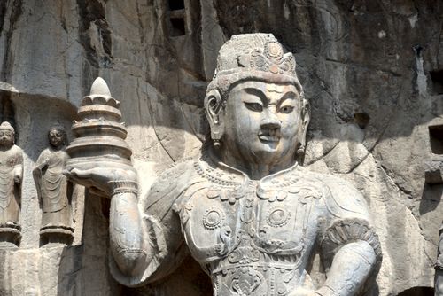 Free Intricate stone carving of a Buddha statue at a historic site, showcasing ancient artistry. Stock Photo