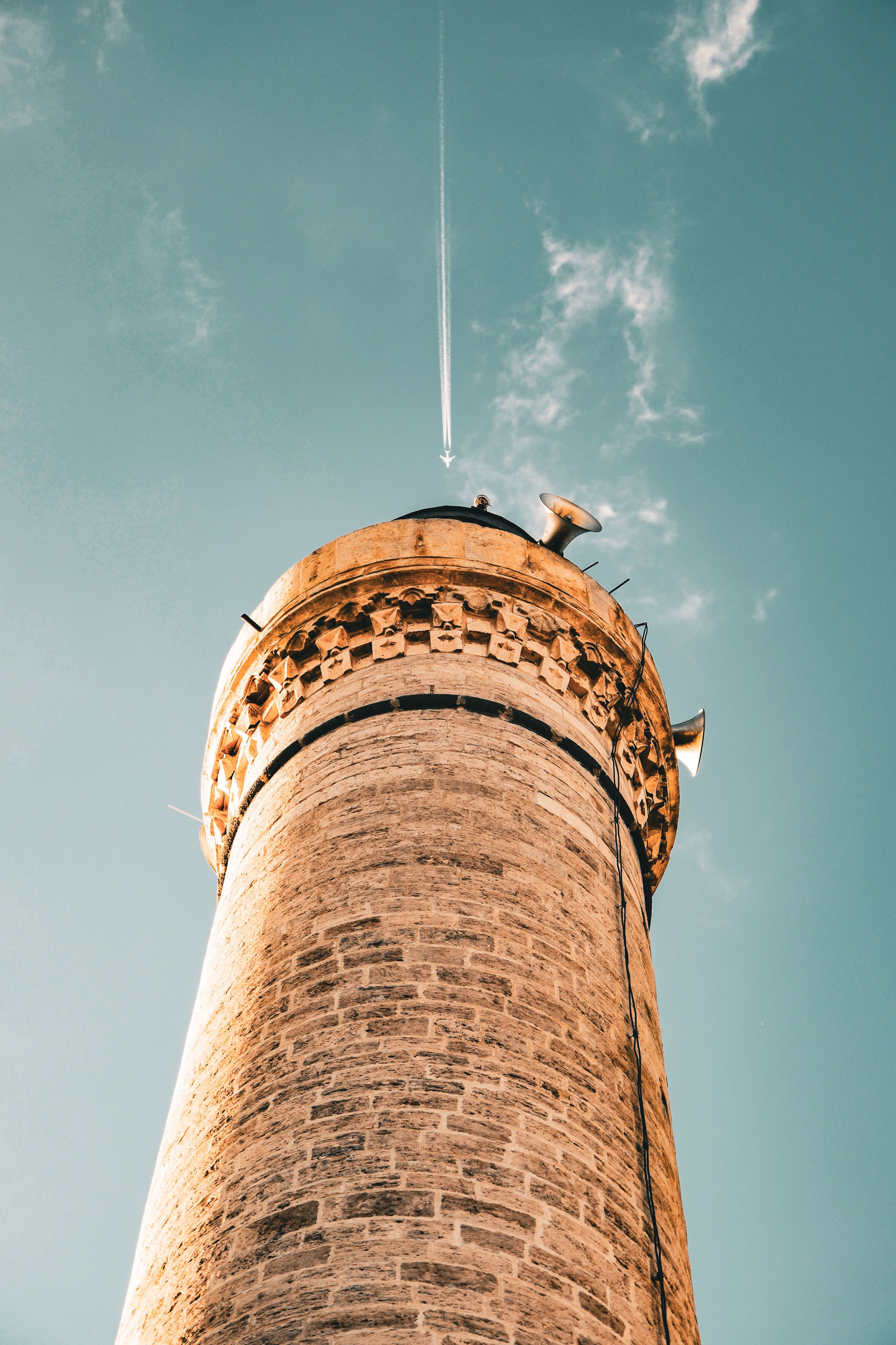 Majestic Stone Tower Against Blue Sky · Free Stock Photo