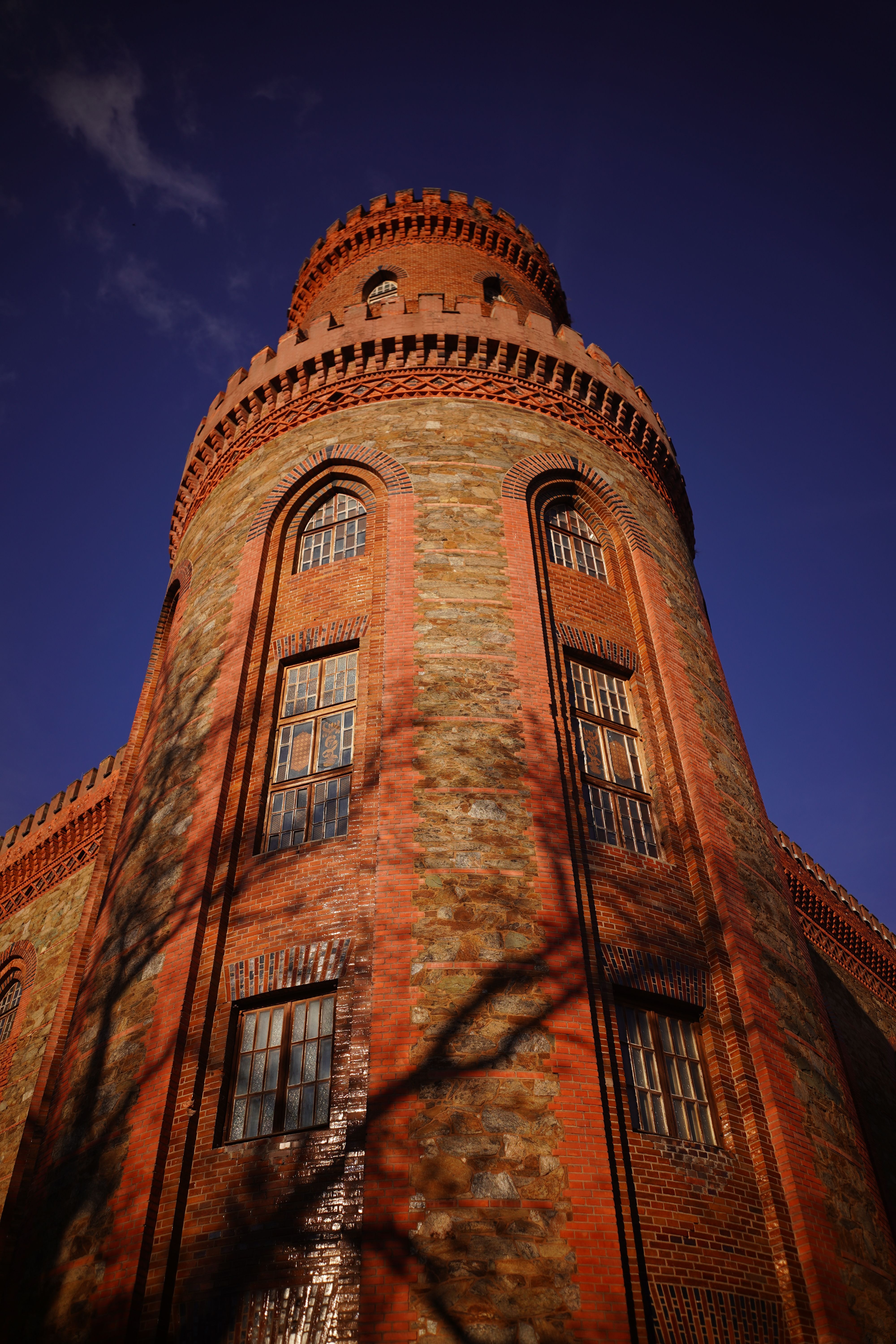 Historic Brick Tower Against Blue Sky · Free Stock Photo