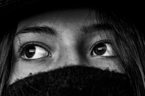Free Artistic black and white close-up of a woman's eyes, evoking mystery and emotion. Stock Photo