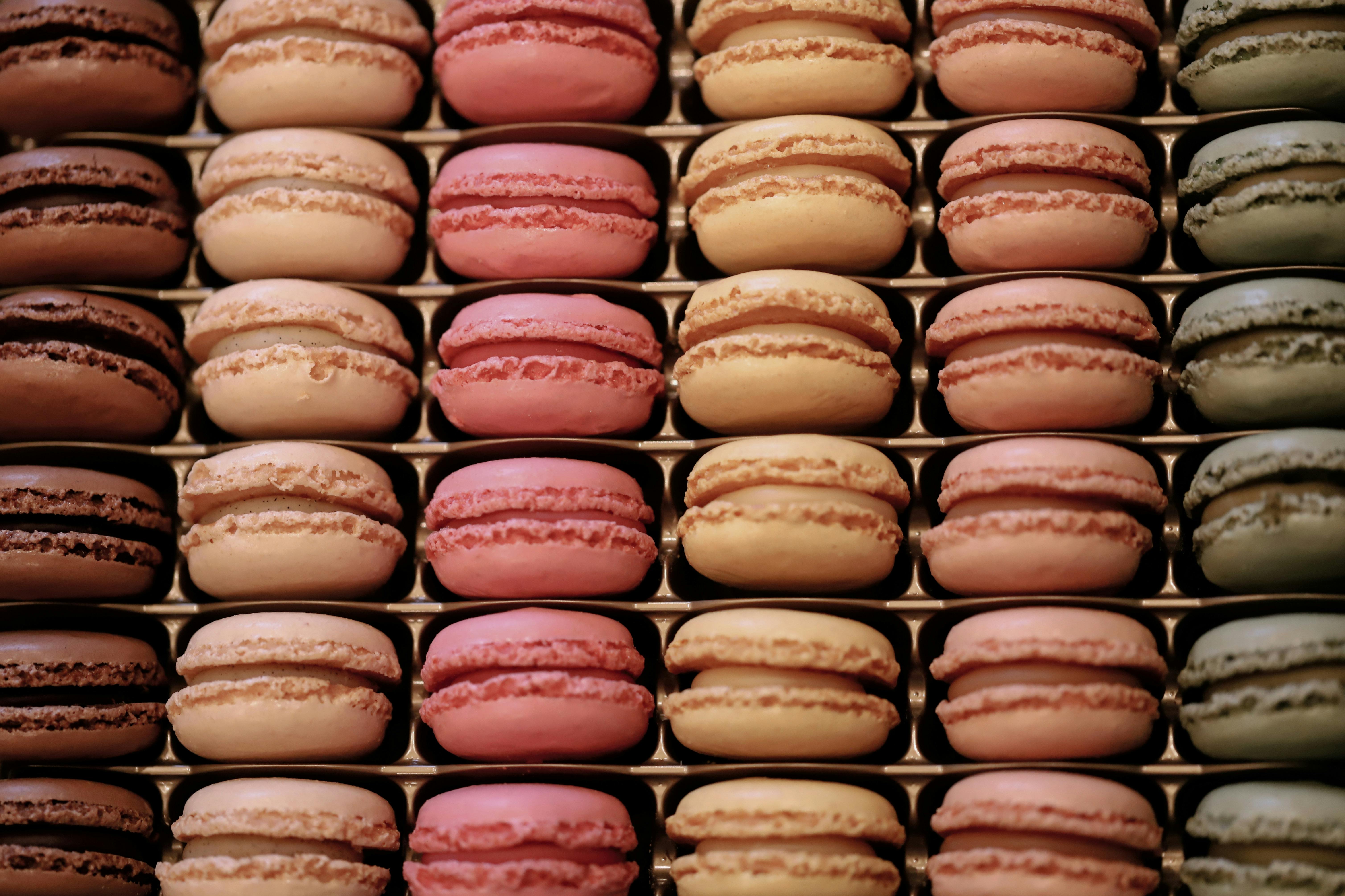 Colorful macarons stacked in a pattern, showcasing vibrant pastel hues and delicious textures.