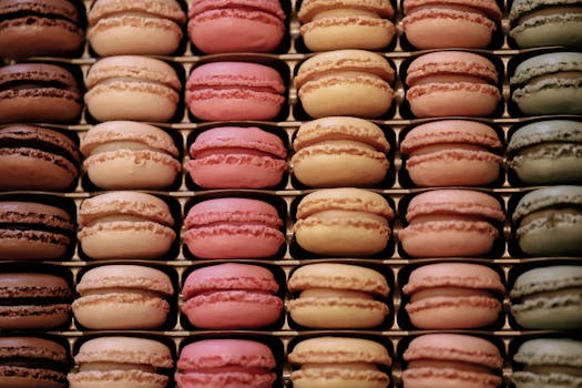 Colorful macarons stacked in a pattern, showcasing vibrant pastel hues and delicious textures.