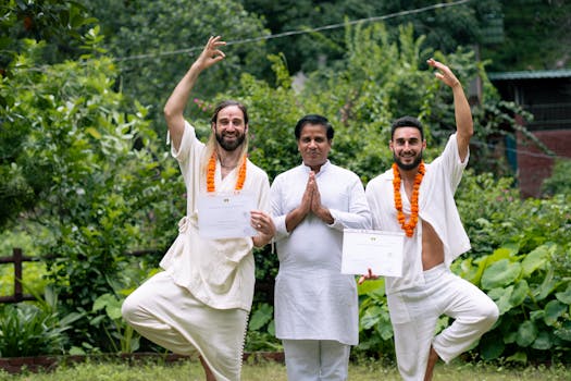 Yoga graduates celebrating certification with instructor in Rishikesh, India.