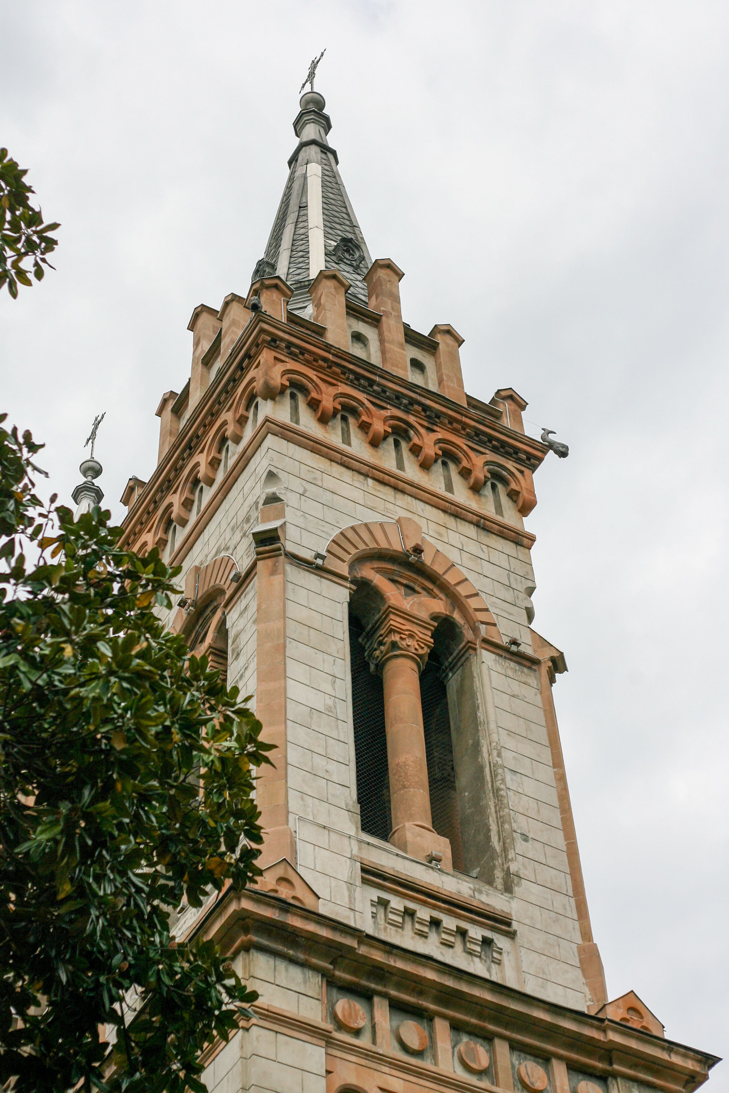 Historic Church Tower Against Cloudy Sky · Free Stock Photo