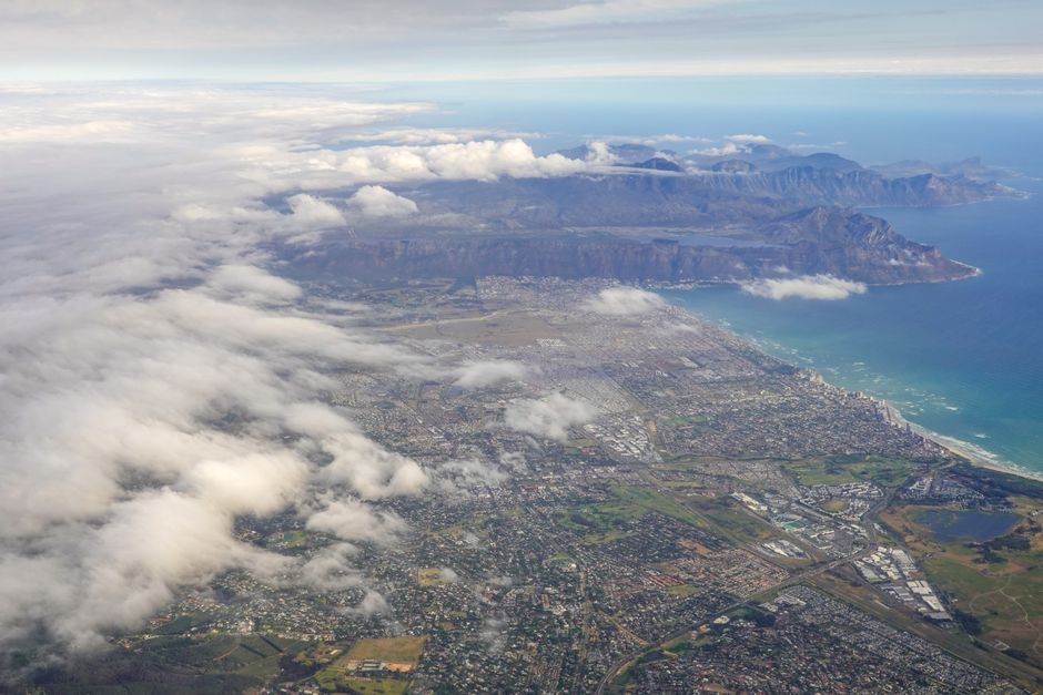Spectacular Cape of Good Hope Scenic Helicopter Flight with Free Boat Cruise Review Review 2026 - Stunning aerial view of Cape Town showcasing the city, coastline, and mountains under cloud cover.