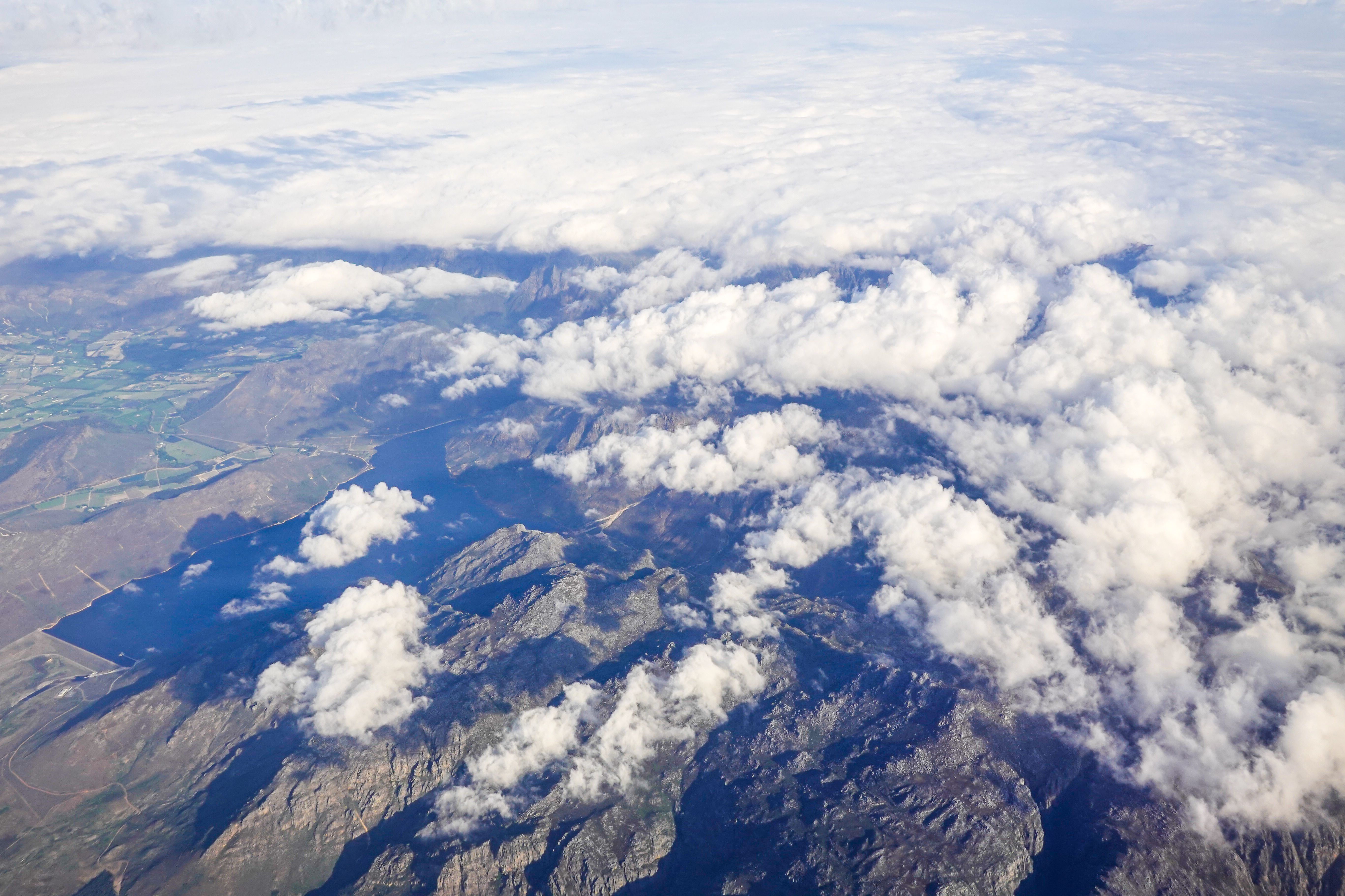 Breathtaking Aerial View of Mountain Range with Clouds · Free Stock Photo
