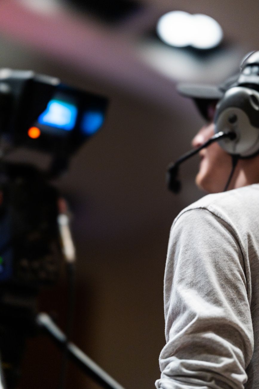 Broadcast camera operator in a live studio