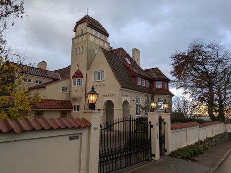 A picturesque view of a historic European villa with vintage architecture and elegant lighting.