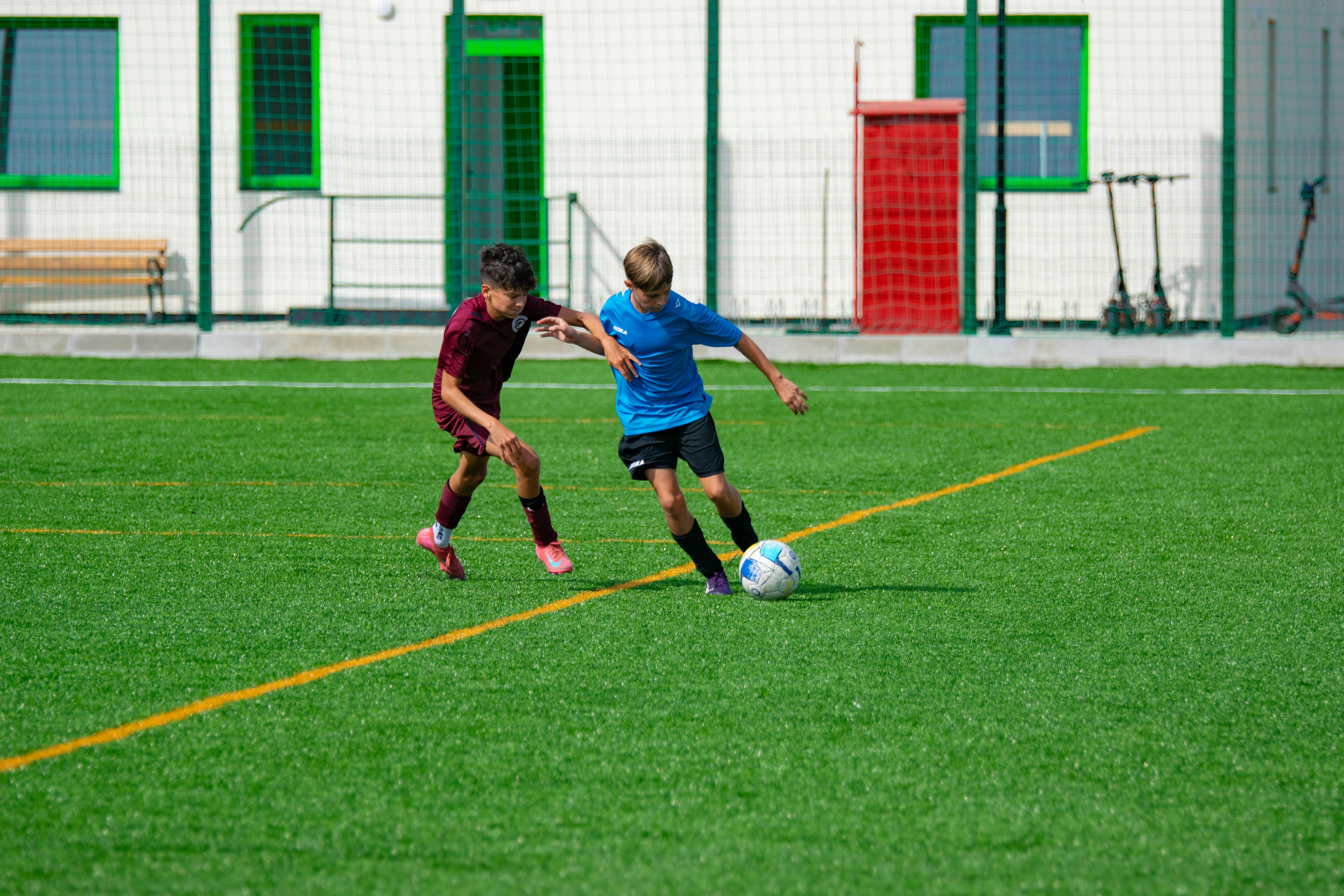 Football player with a soccer ball on the field, focus on data analytics