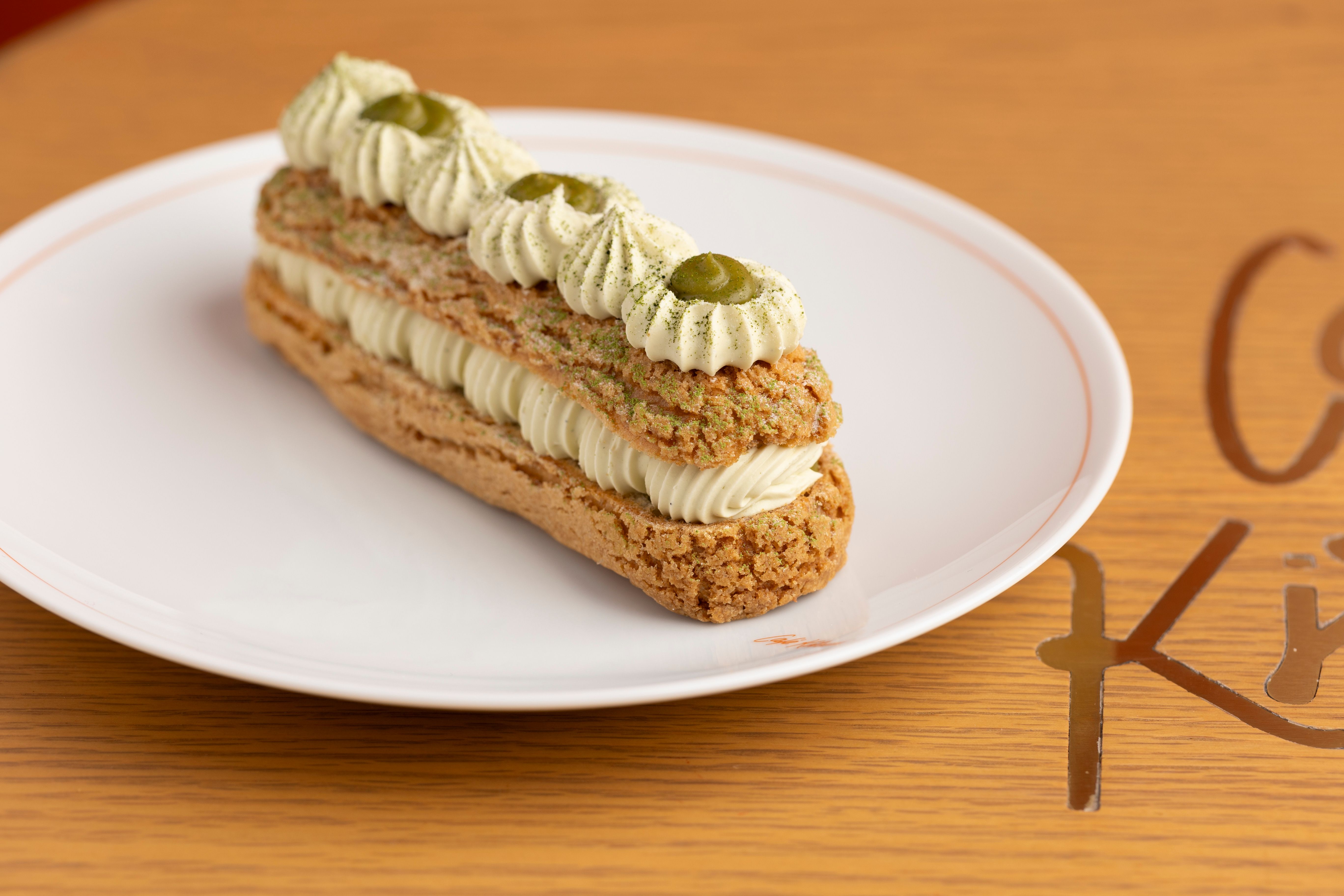 Delicious Matcha Eclair on a White Plate · Free Stock Photo