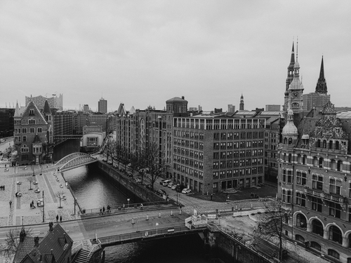 Free A black and white aerial view of a historic European city with canals and classic architecture. Stock Photo