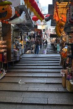 Colorful street market stairs adorned with lanterns, showcasing lively ambiance and culture.
