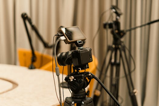 A professional studio with cameras, microphones, and other equipment ready for recording or live streaming.