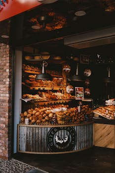 A cozy bakery features a variety of freshly baked breads in a warm, rustic setting.