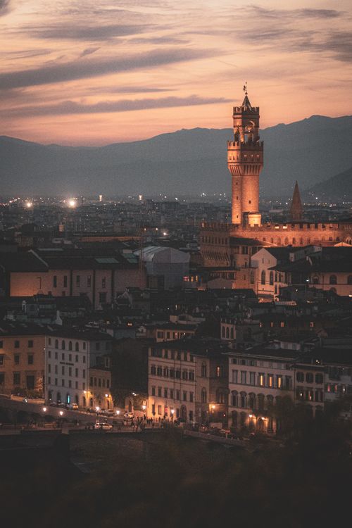 Free Scenic view of Palazzo Vecchio at sunset in Florence, Tuscany, featuring a vibrant cityscape. Stock Photo