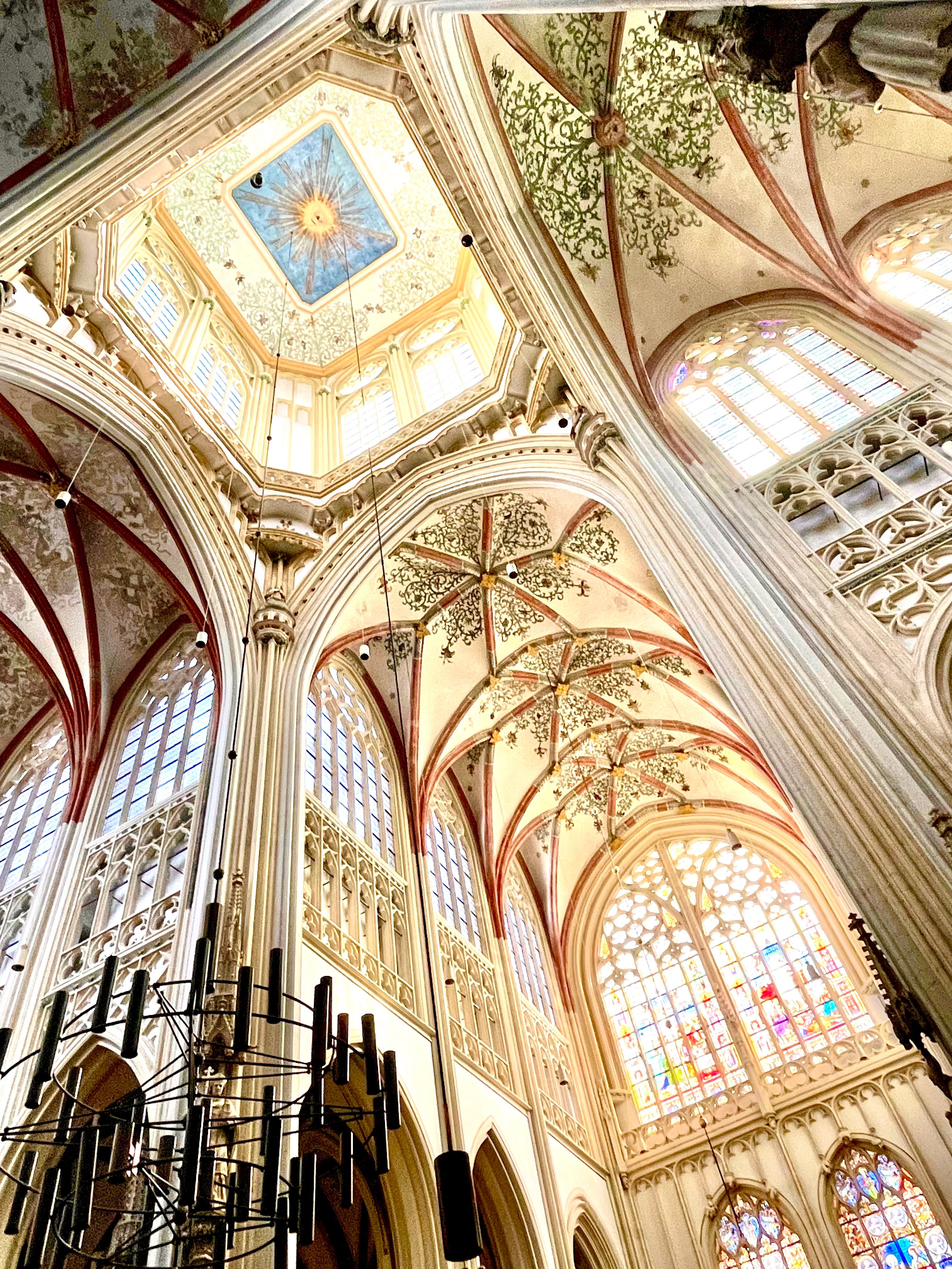 Explore the intricate details of St. John's Cathedral in 's-Hertogenbosch, featuring Gothic architecture and vibrant stained glass.
