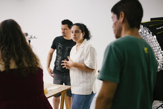 Creative team engaged in a brainstorming session in a studio environment.