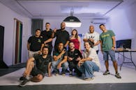 Diverse Group Poses Cheerfully in Photography Studio
