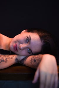 Emotive artistic portrait with tattoos