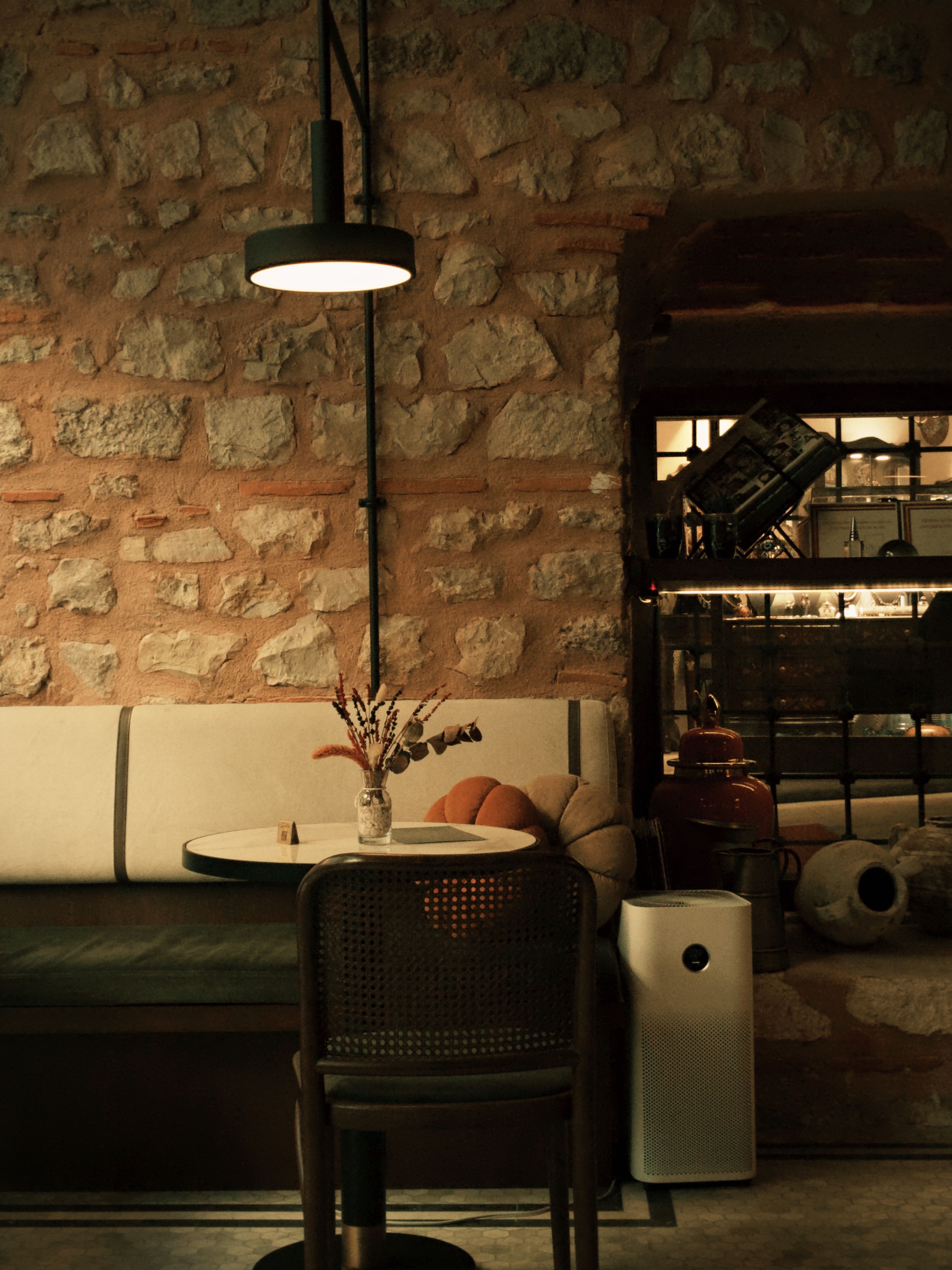 Cozy Rustic Café Interior with Warm Lighting · Free Stock Photo