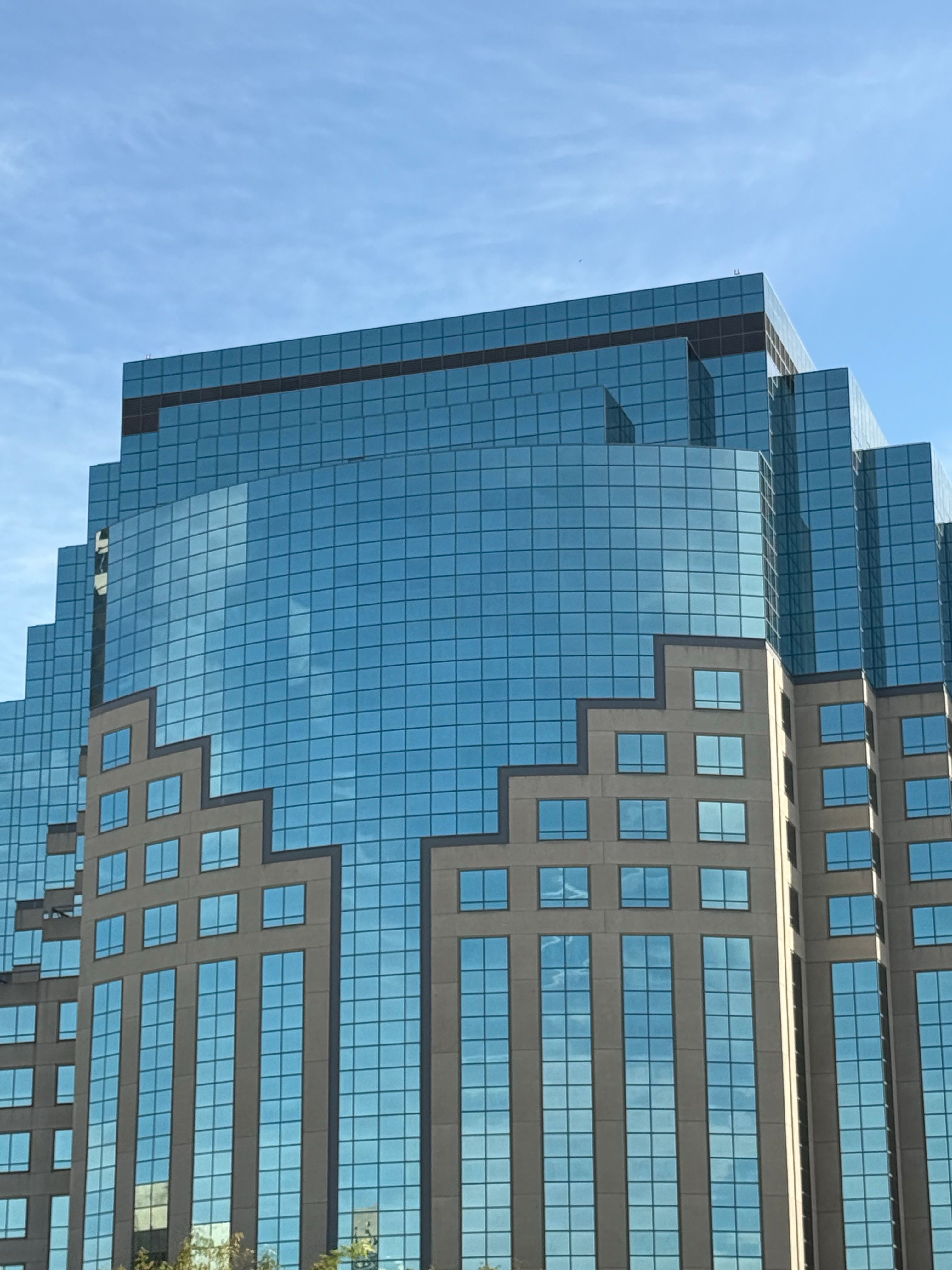 Modern Blue Glass Skyscraper Under Clear Sky · Free Stock Photo