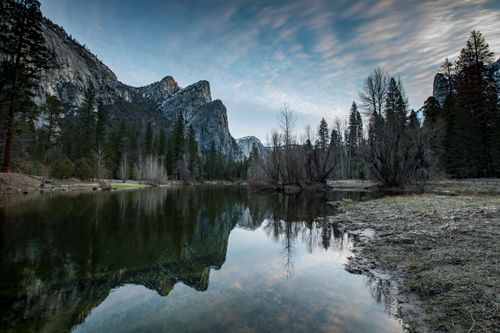 Free Scenic view of Yosemite's landscape with mountains reflecting in a calm river under a serene sky. Stock Photo