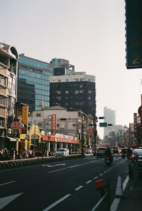 Free Vibrant street view of Tainan, Taiwan, showcasing busy traffic and urban architecture. Stock Photo