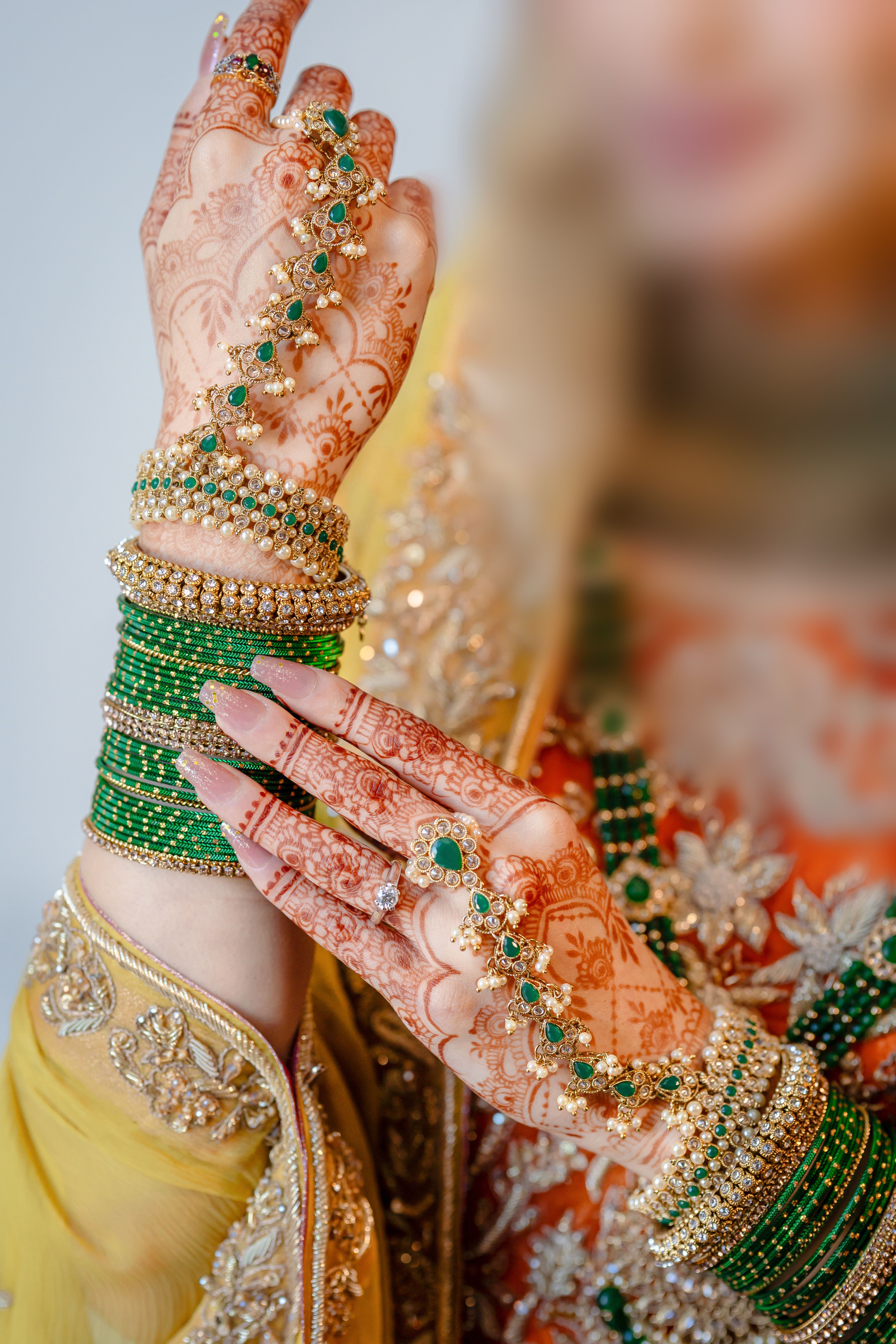 Indian bride hands with mehendi and bangles for Bale Shastra ritual