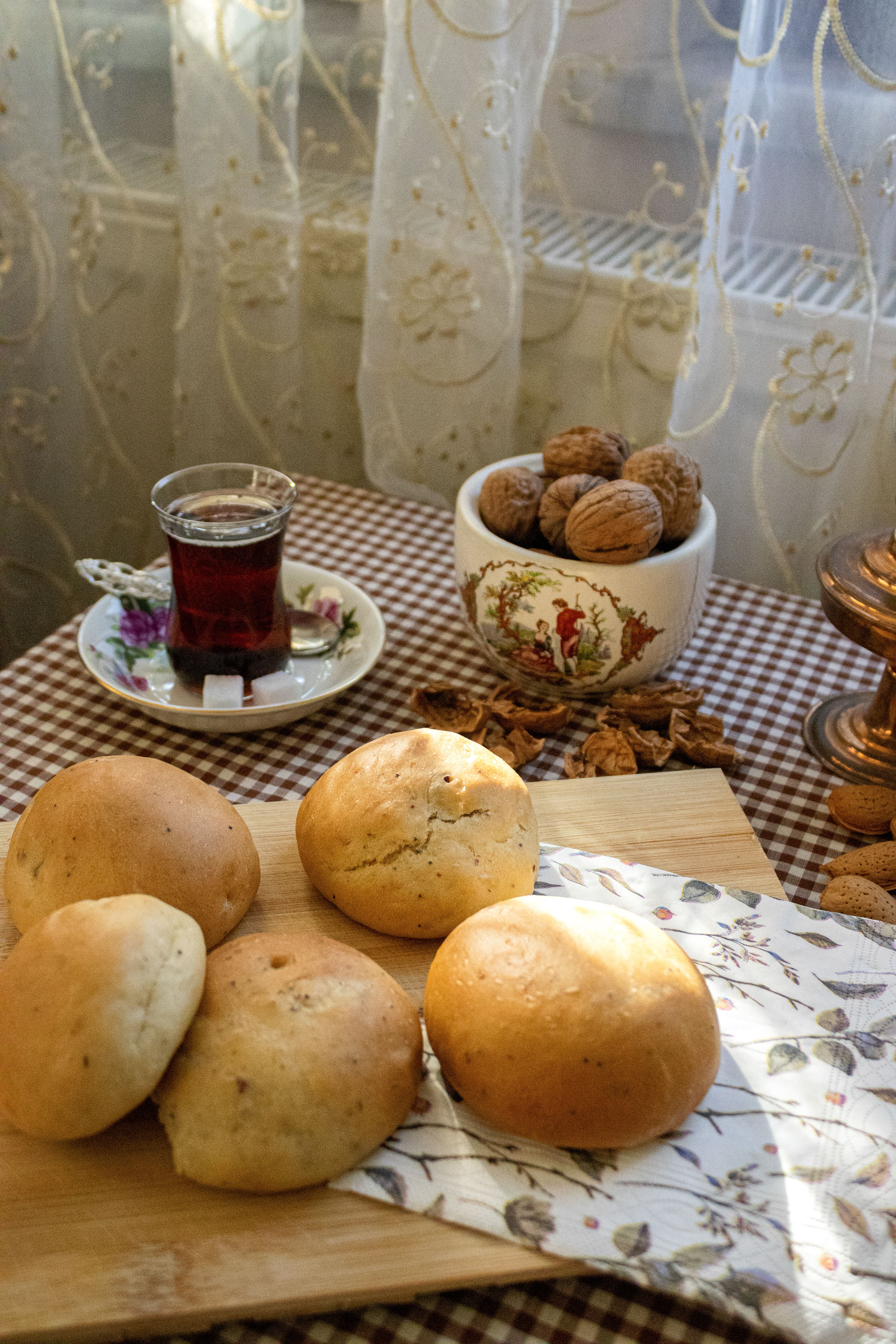 Cozy Indoor Setting with Fresh Bread and Tea · Free Stock Photo