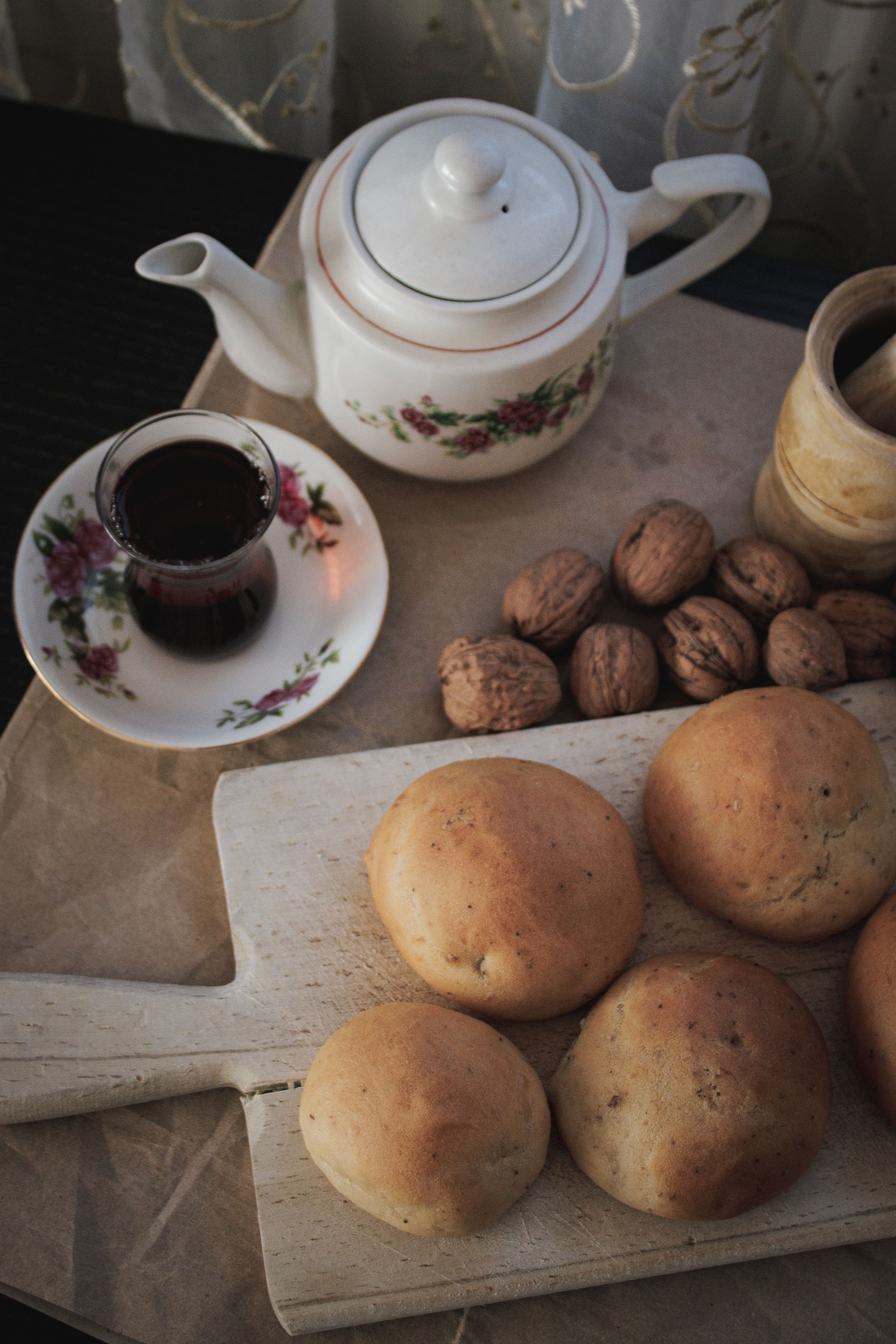 Traditional Tea Setting with Fresh Bread and Nuts · Free Stock Photo