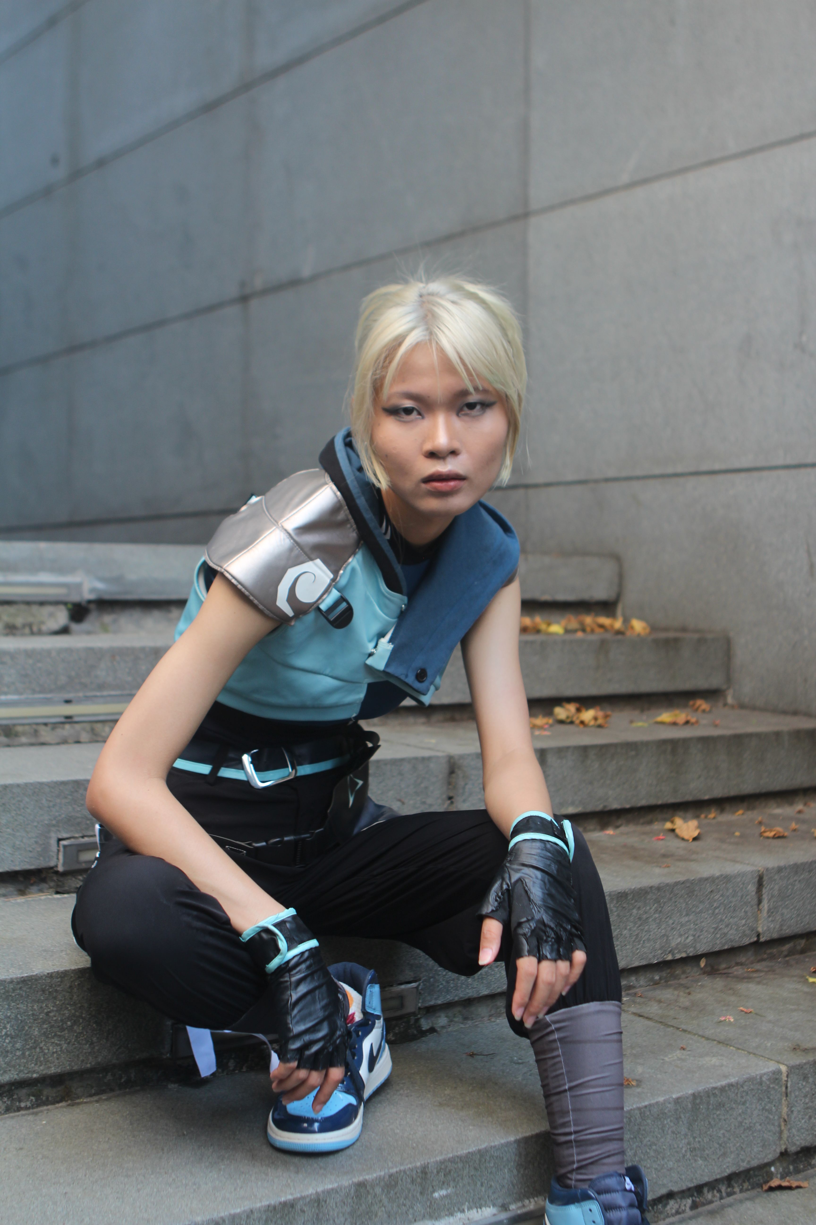 Stylish Cosplayer Posing on Urban Steps · Free Stock Photo