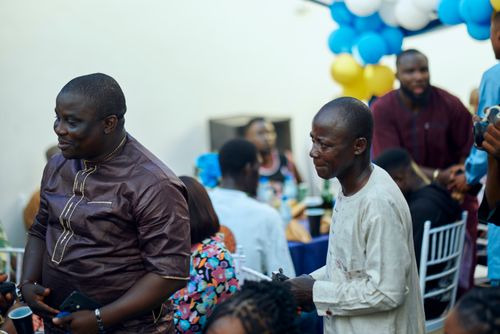 Free People enjoying a cheerful gathering with vibrant decor and social interactions. Stock Photo