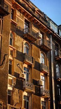 Stunning image of a historic building facade in Bucharest, Romania, captured in warm autumn light.