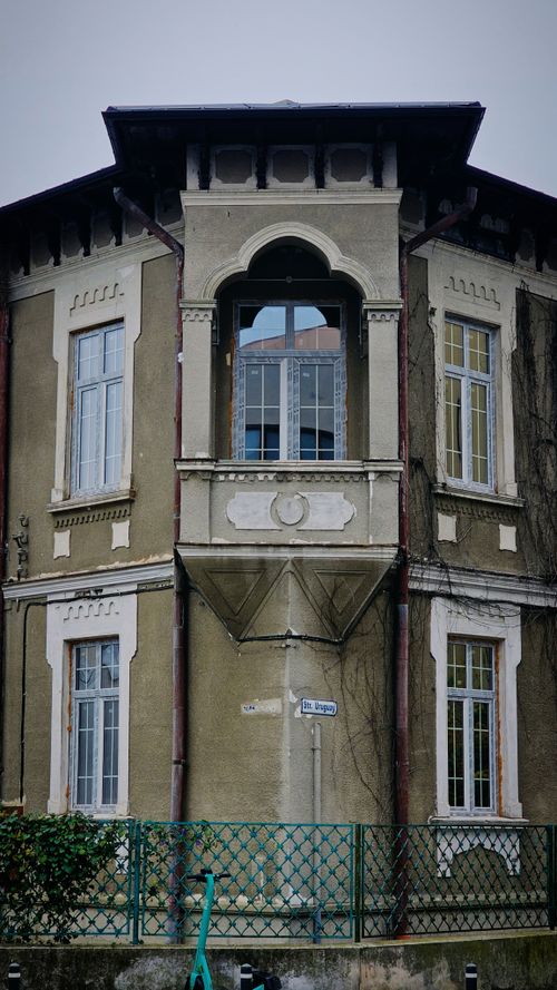 Free Old architectural facade in Bucharest, Romania, showcasing historic design and autumn atmosphere. Stock Photo